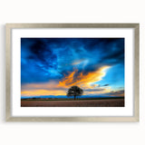 Silver-framed landscape artwork featuring fields and vibrant green hues, elegantly matted for a polished look, ideal for home decor enhancement.