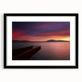 Abstract art print of a European scenery in vibrant colors on a large textured canvas, framed in black.