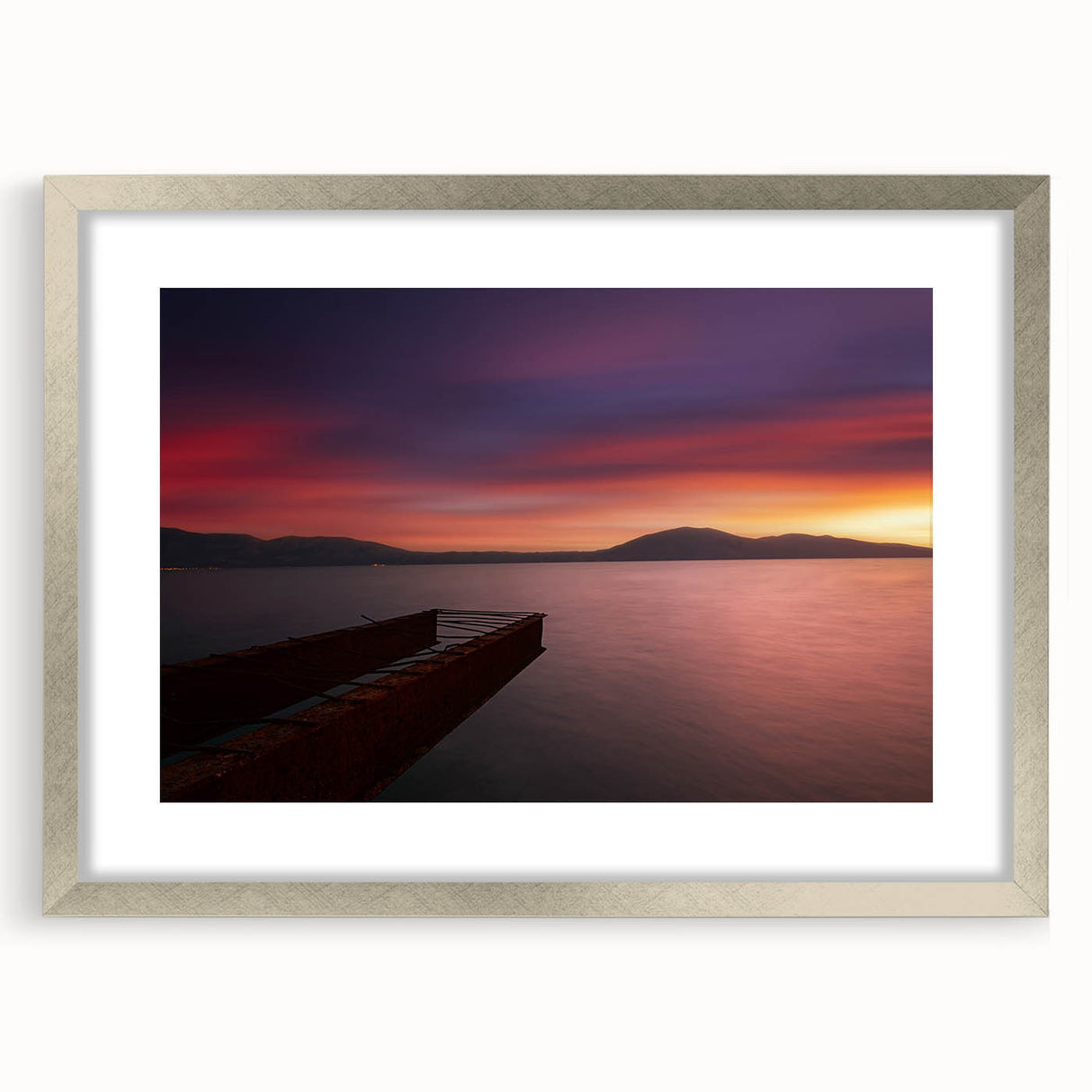 Extra large wall art featuring a textured abstract print of European scenery in muted earth tones, framed in silver.