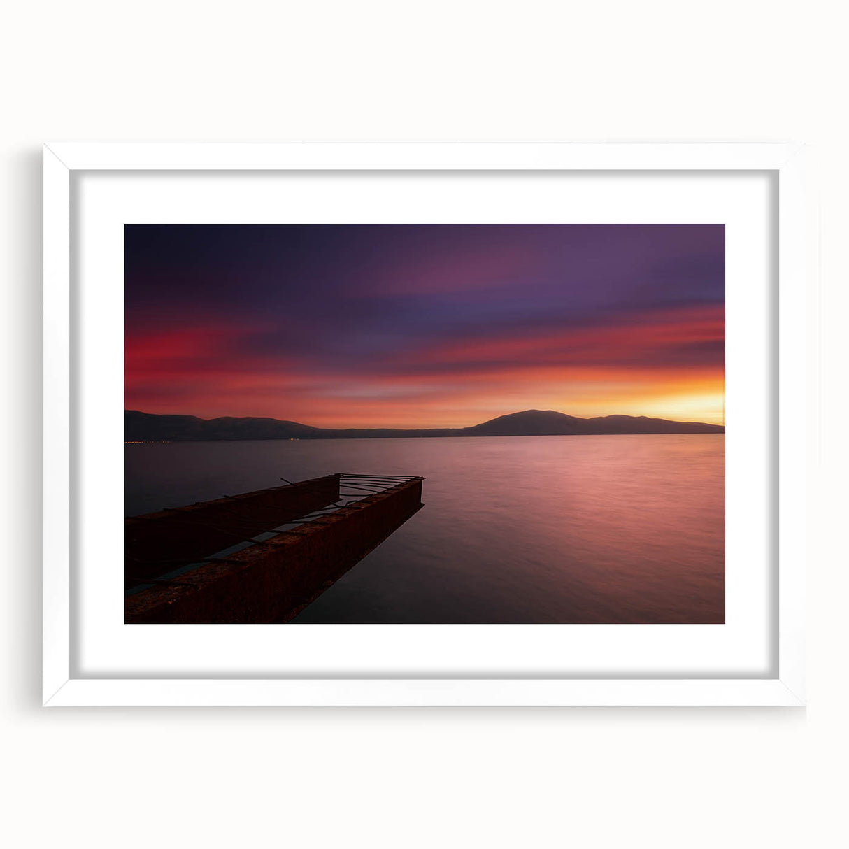 Textured abstract art print depicting a European Albanian scenery in muted earth tones, framed in white.