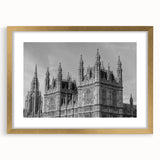 Abstract art print of London scenery in muted gold and blue tones on a framed canvas, ideal for dining room decor.