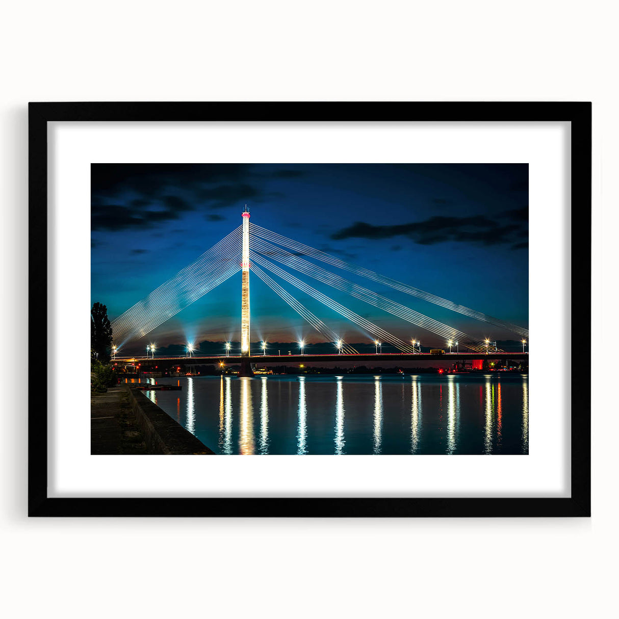Abstract art print featuring a colorful, textured depiction of a European landscape on a large canvas, framed in black.