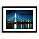 Abstract art print featuring a colorful, textured depiction of a European landscape on a large canvas, framed in black.