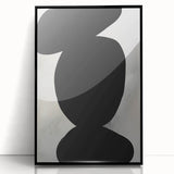 Abstract minimalist wall art framed in black acrylic, showcasing soft geometric shapes and subtle color gradients, perfect for modern decor.
