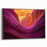 Framed canvas art showcasing a stunning landscape of vibrant canyons in warm earth tones, elegantly displayed with a sleek black frame, perfect for home decor.