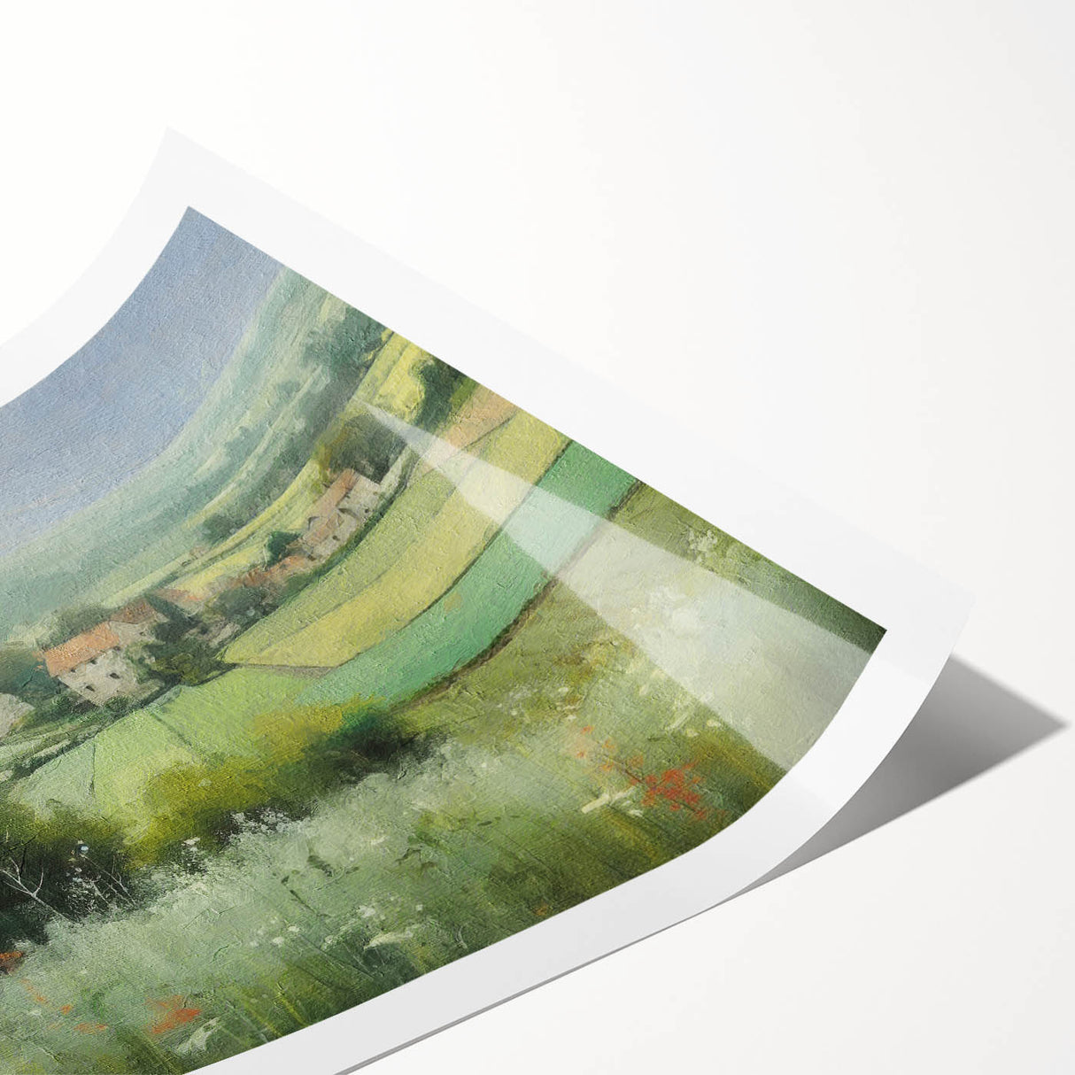 Rolled print of a serene countryside landscape, showcasing lush green fields and a vibrant blue sky, packaged in a protective cardboard tube for easy display.