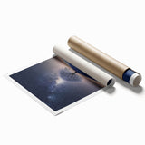 Desert landscape rolled canvas print showcasing vibrant hues of orange and yellow sunset over sand dunes, elegantly packaged for safe delivery in a sturdy tube.