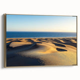 Framed canvas artwork showcasing stunning desert dunes in warm gold tones, elegantly displayed from a side view to highlight its texture and depth. Perfect for home decor.