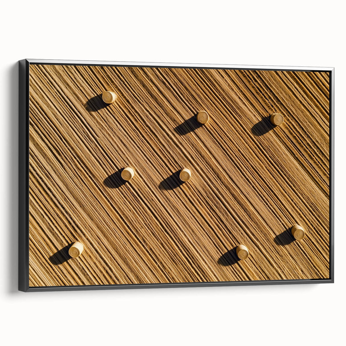 Black-framed canvas artwork showcasing a serene landscape of vibrant green fields and rolling hills, perfect for enhancing home decor with natural beauty and tranquility.