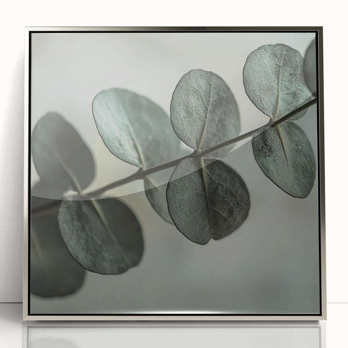 Mid-century modernist art depicting close-up leaves in silver tones on a framed acrylic, suitable for nursery wall decor.