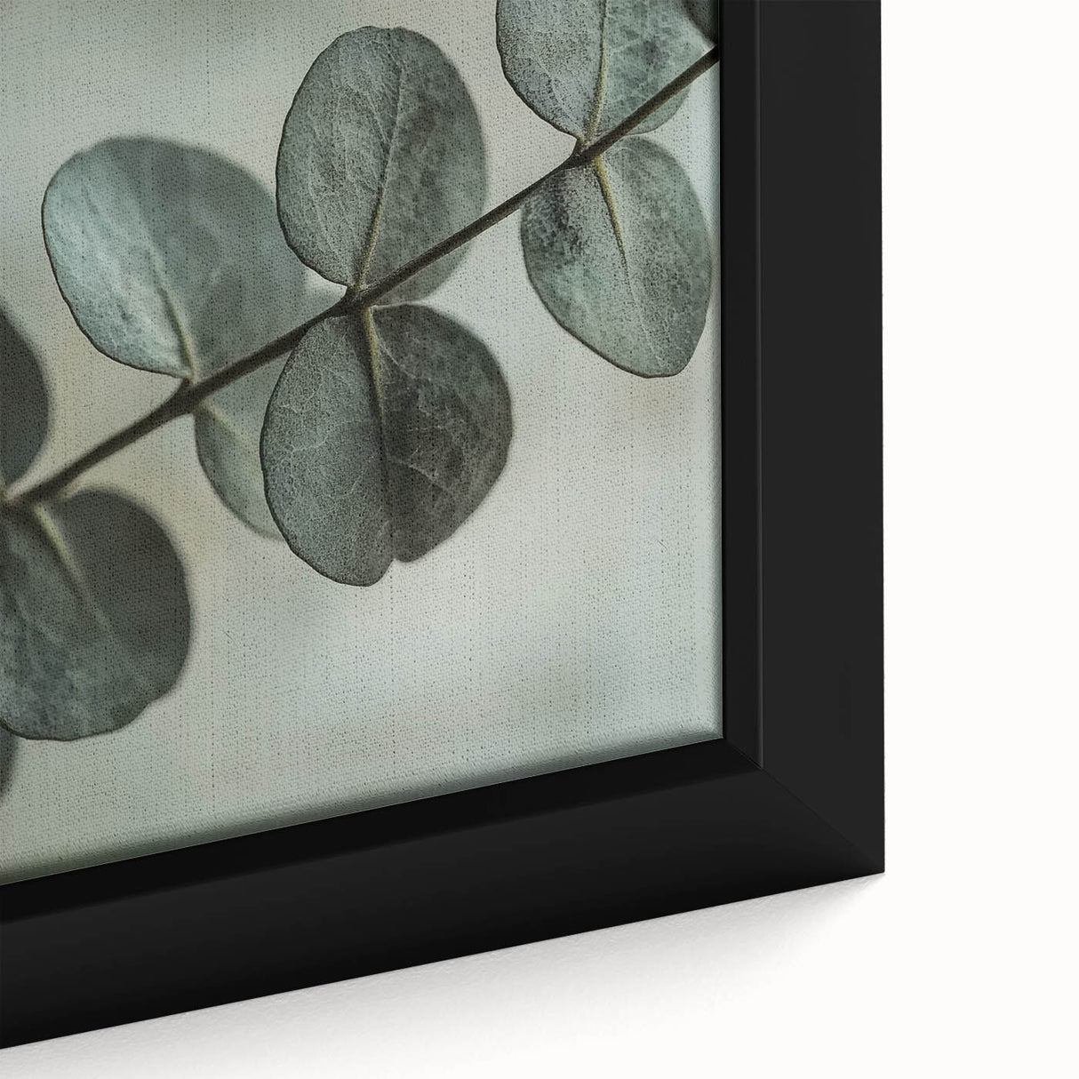 Close-up of textured leaves in black, framed canvas, ideal for living room decor.