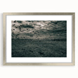 Abstract art print depicting a textured European scenery in muted earth tones, framed in silver, ideal for living room decor.