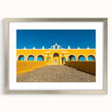 Textured art print of an abstract Yucatan scenery in muted earth tones on a framed silver mat, suited for bedroom art.