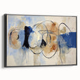 Framed canvas art displaying a modern abstract design with vibrant splatters in black and multicolor hues, showcasing a contemporary aesthetic perfect for any room.