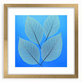 Extra large abstract art print featuring close-up textured leaves in green and gold hues, framed in gold.