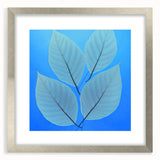 Textured art print of abstract green leaves, framed in silver, ideal for bedroom decor.