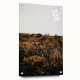 Large abstract wall art depicting autumnal trees on acrylic glass, with warm orange and red tones.
