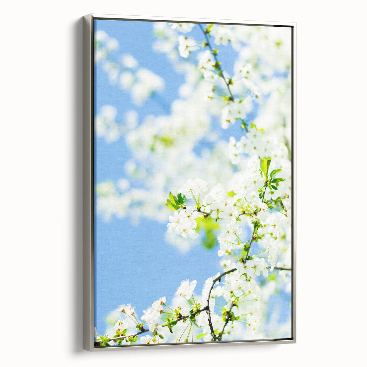 Landscape art painting of a spring scene with vibrant green and floral tones on a framed canvas.