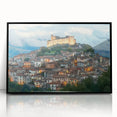 Framed acrylic artwork showcasing a vibrant landscape with a majestic castle, presented in a sleek black frame, perfect for enhancing home decor.