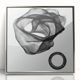 Framed acrylic artwork showcasing a sleek, modern abstract geometric design in silver tones, perfect for contemporary home decor. The piece features sharp angles and layered shapes, enhancing visual intrigue while complementing minimalist interiors.