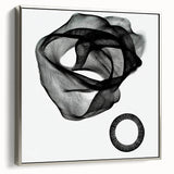 Framed abstract geometric canvas art in silver, showcasing intricate patterns and textures, ideal for modern decor and artistic interiors, side view.