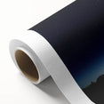 Rolled canvas showcasing a vibrant landscape barn scene with rich colors, securely packaged in a durable cardboard tube for safe shipping and storage.