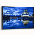 Framed canvas artwork depicting a scenic landscape with a majestic castle, presented in a sleek black frame, showcasing vibrant colors and intricate details. Ideal for enhancing home decor with a touch of elegance.