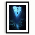 Framed black landscape artwork featuring a cave scene, showcasing intricate details and textures, perfect for modern home decor in a stylish setting.
