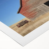 Rolled canvas artwork depicting a serene landscape with a rustic barn surrounded by lush greenery, packaged securely in a durable cardboard tube for safe delivery.