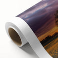 Vibrant rolled canvas showcasing a serene landscape with rolling green fields under a clear blue sky, elegantly packaged in a protective cardboard tube for safe delivery.