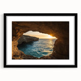 Framed landscape artwork depicting a serene cave scene, featuring a black mat and sleek frame, ideal for home decor and artistic expression.