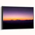 Framed canvas artwork showcasing a stunning desert landscape in warm tones, featuring a black frame that enhances the visual depth and elegance, ideal for home decor.