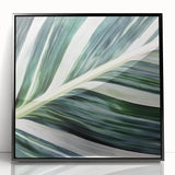 Large abstract wall art featuring close-up green leaves, set in a black frame, suited for modern art wall decor.