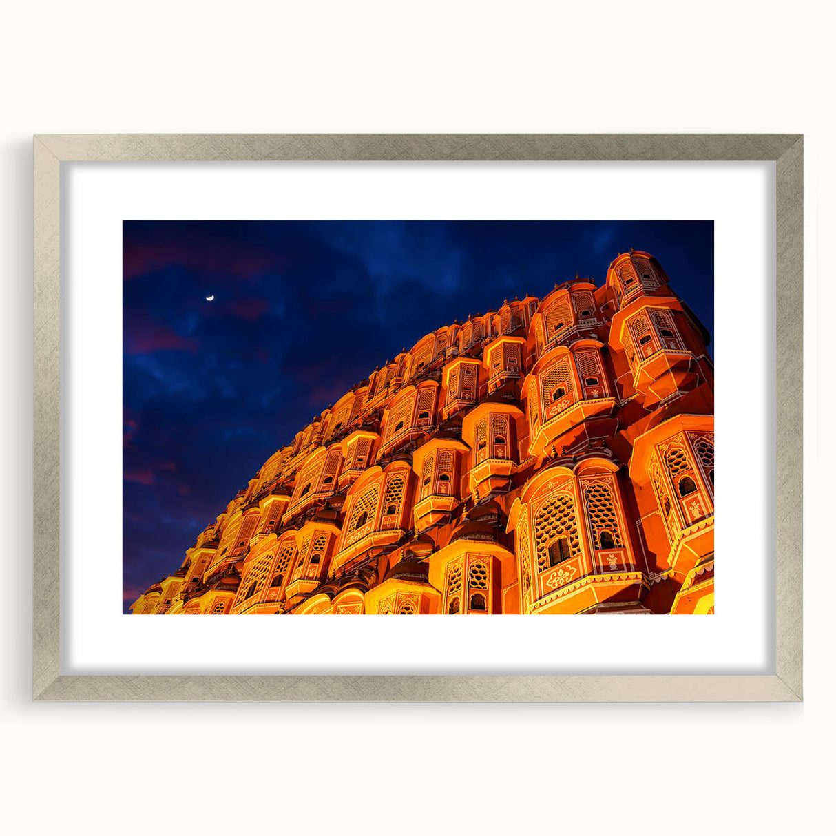 Textured abstract art print featuring a silver-framed depiction of an Indian scenery in earth tones.