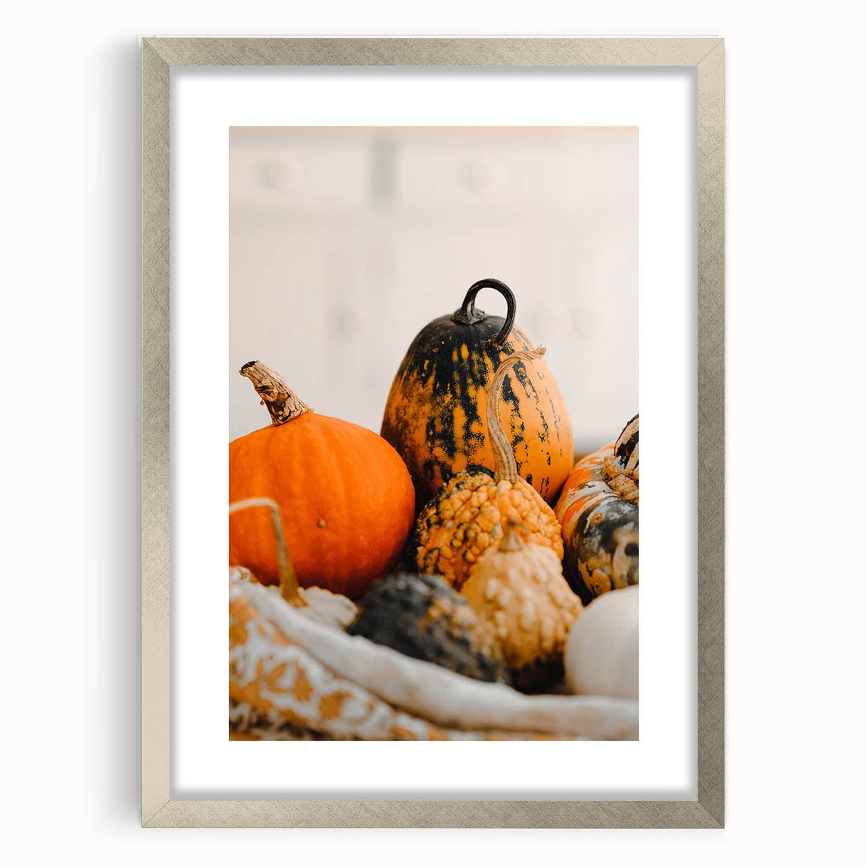 Textured abstract art print in warm autumn hues on a framed silver canvas, suitable for bedroom decor.