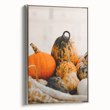 Framed canvas featuring a vintage-style landscape painting of autumn trees with colorful foliage against a black background.