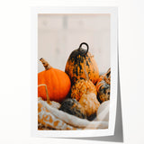 Rolled print of autumnal trees in warm orange and red tones, suitable for art wall dining room.