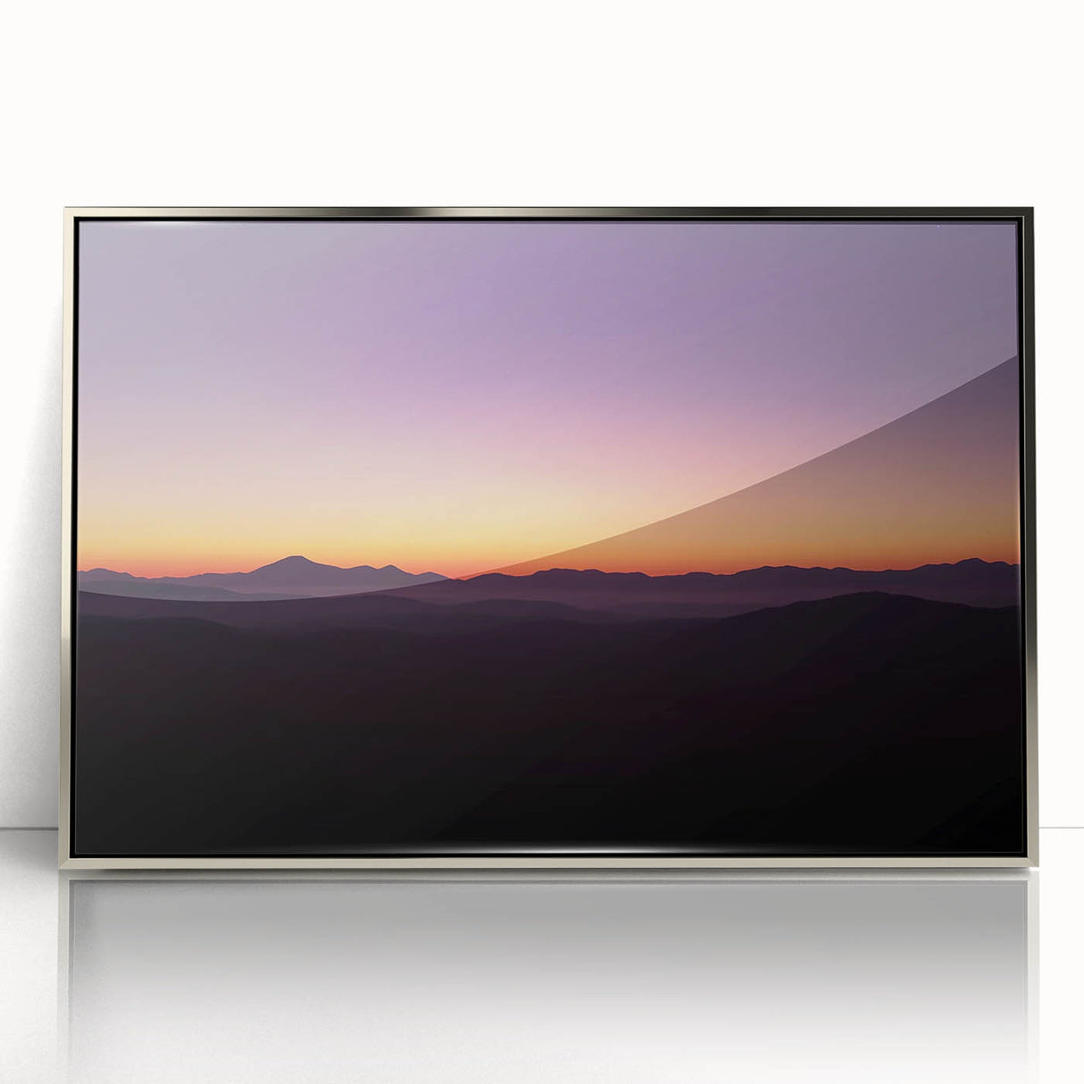 Framed acrylic artwork depicting a serene desert landscape with warm hues of orange and gold, perfect for modern home decor. This elegant piece adds a touch of tranquility and sophistication to any room.
