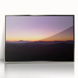 Framed acrylic artwork depicting a serene desert landscape with warm hues of orange and gold, perfect for modern home decor. This elegant piece adds a touch of tranquility and sophistication to any room.