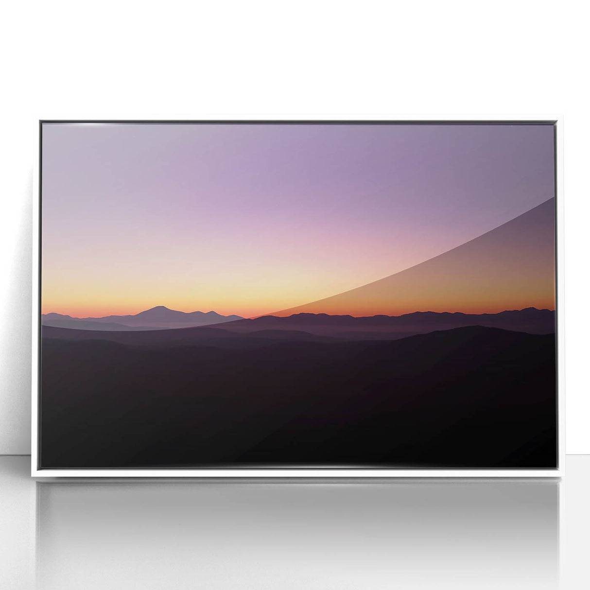 Framed acrylic artwork depicting a serene desert landscape with vibrant colors, showcasing rolling sand dunes and a clear blue sky, ideal for home decor.