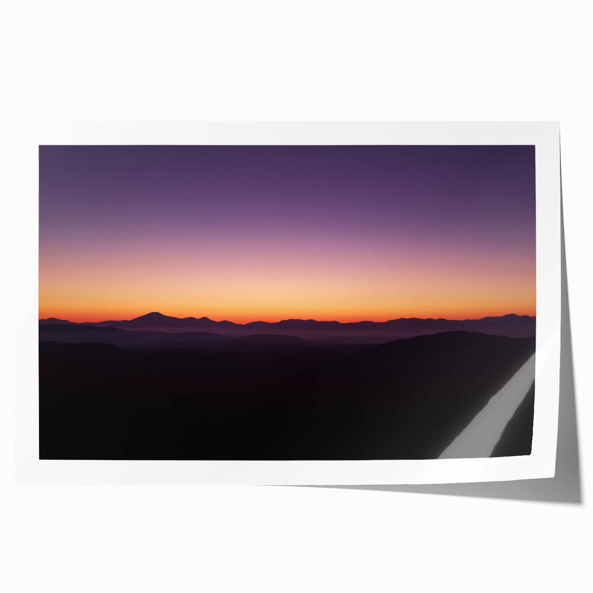 Desert landscape rolled canvas print showcasing vibrant hues of orange and yellow, capturing the serene beauty of arid terrain, elegantly packaged in a protective tube.