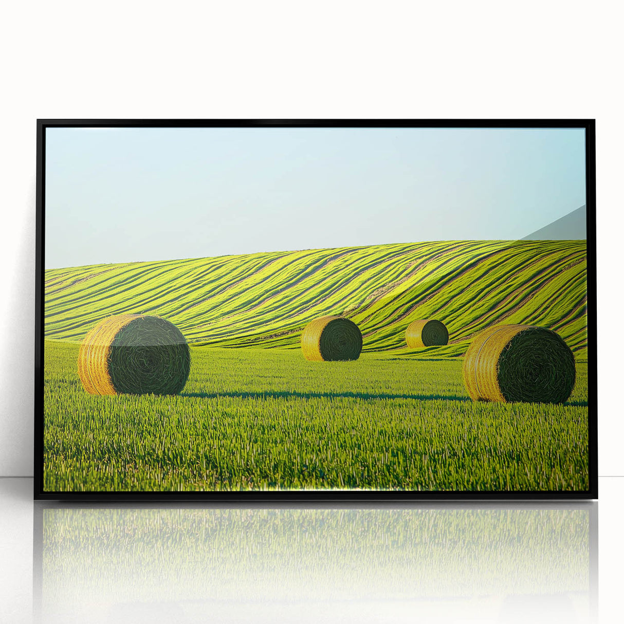 Framed acrylic artwork featuring a serene landscape of lush green fields under a clear blue sky, designed to enhance modern home decor. Ideal for nature enthusiasts.