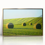 Framed acrylic artwork depicting a serene landscape field with lush green grass and a clear blue sky, featuring elegant gold accents for a sophisticated decor touch.