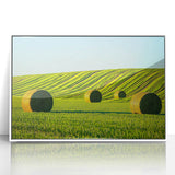 Framed acrylic artwork showcasing a vibrant landscape with rolling fields in shades of green and gold, set in a sleek white frame, ideal for home decor.