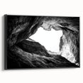 Framed canvas artwork depicting a stunning landscape of canyons in warm earth tones, set against a sleek black frame, perfect for modern home decor.