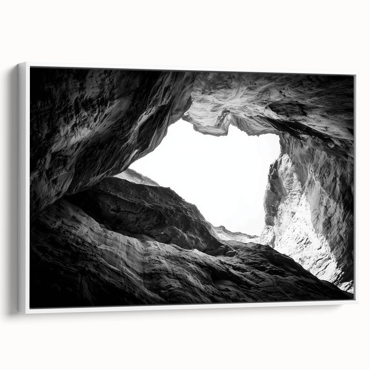 Framed canvas artwork of a vibrant canyon landscape, showcasing rich colors and dramatic formations, presented in a sleek white frame, ideal for home decor.