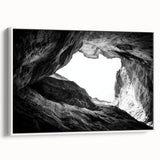Framed canvas artwork of a vibrant canyon landscape, showcasing rich colors and dramatic formations, presented in a sleek white frame, ideal for home decor.