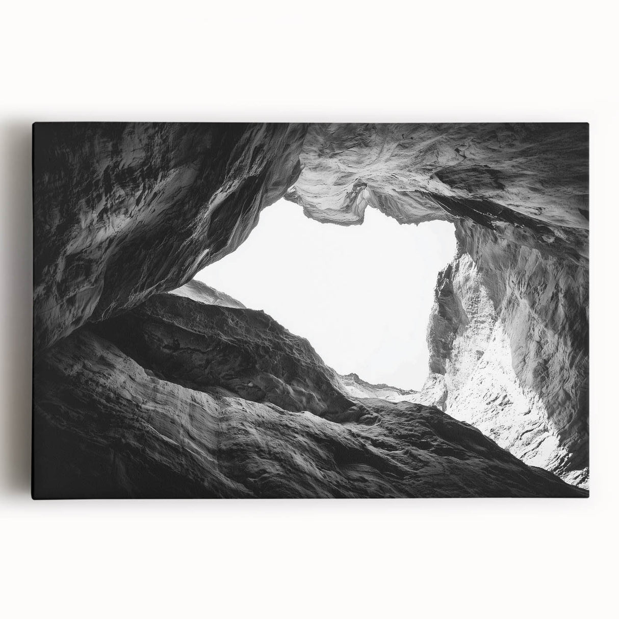 Stretched canvas artwork depicting a vibrant landscape of canyons in rich earth tones, showcasing dramatic rock formations under a bright blue sky, perfect for home decor.