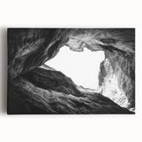 Stretched canvas artwork depicting a vibrant landscape of canyons in rich earth tones, showcasing dramatic rock formations under a bright blue sky, perfect for home decor.