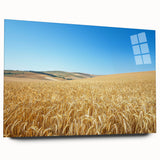 Acrylic landscape artwork depicting a serene countryside scene with rolling hills and a vibrant sunset, showcased in a sleek glass frame, emphasizing natural beauty and tranquility.